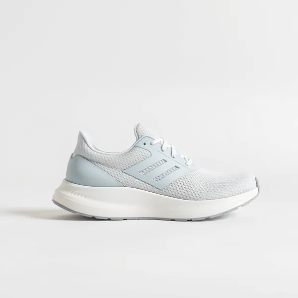 A white running shoe in side profile