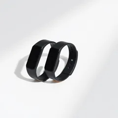Two black fitness tracker bands